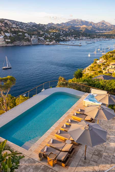 Luxury villa rental with a private pool in Mallorca, featuring a terrace with stunning views to the sea.