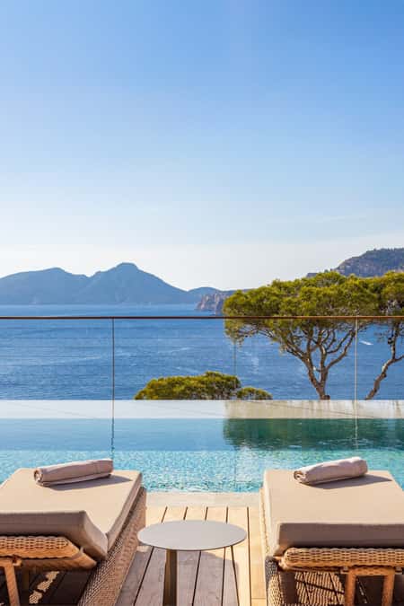 Luxury villa rental with a private pool in Mallorca, featuring a terrace with stunning views to the sea.